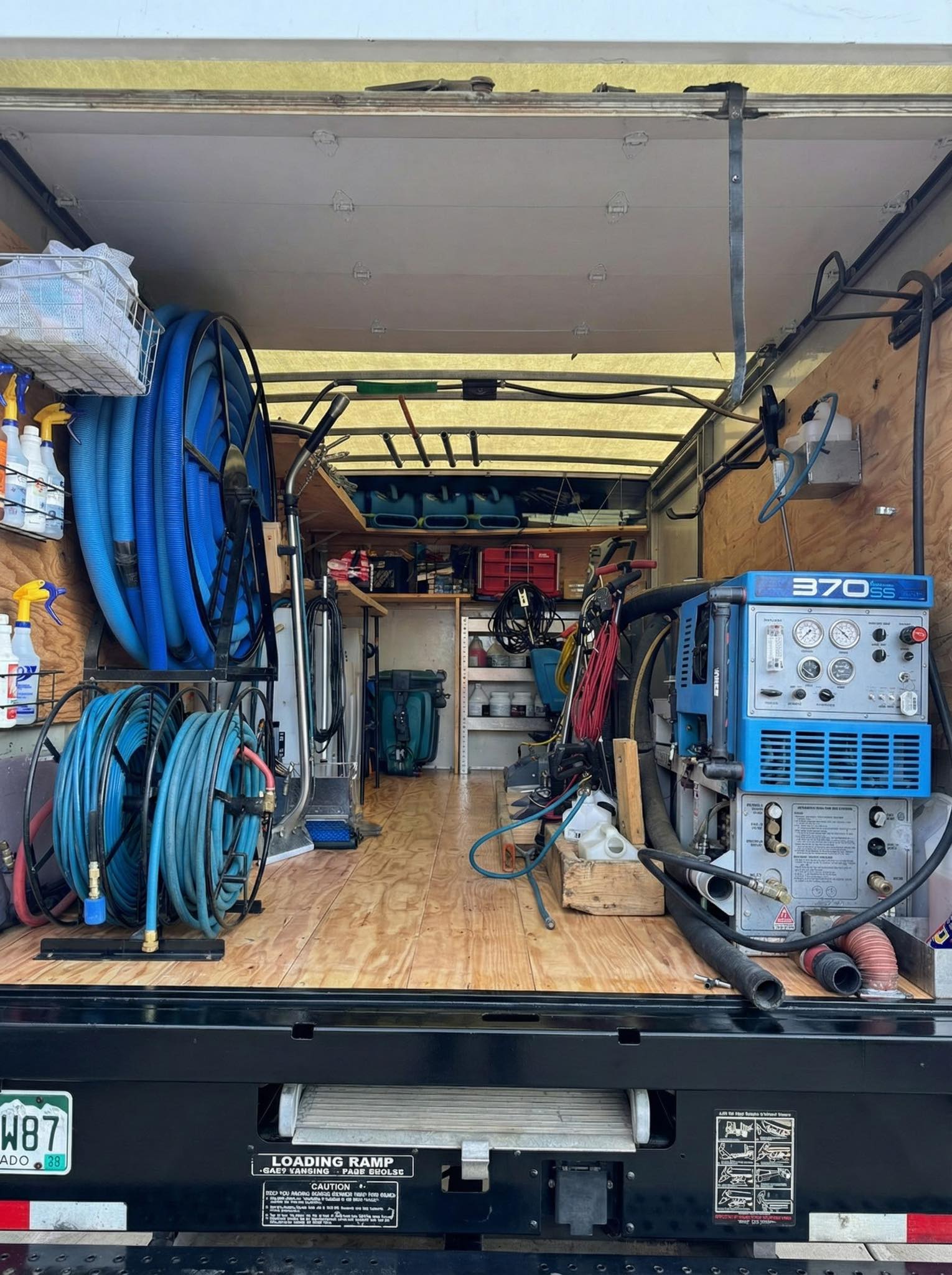 Inside Sasquatch Carpet Cleaning's box truck — full commercial equipment setup
